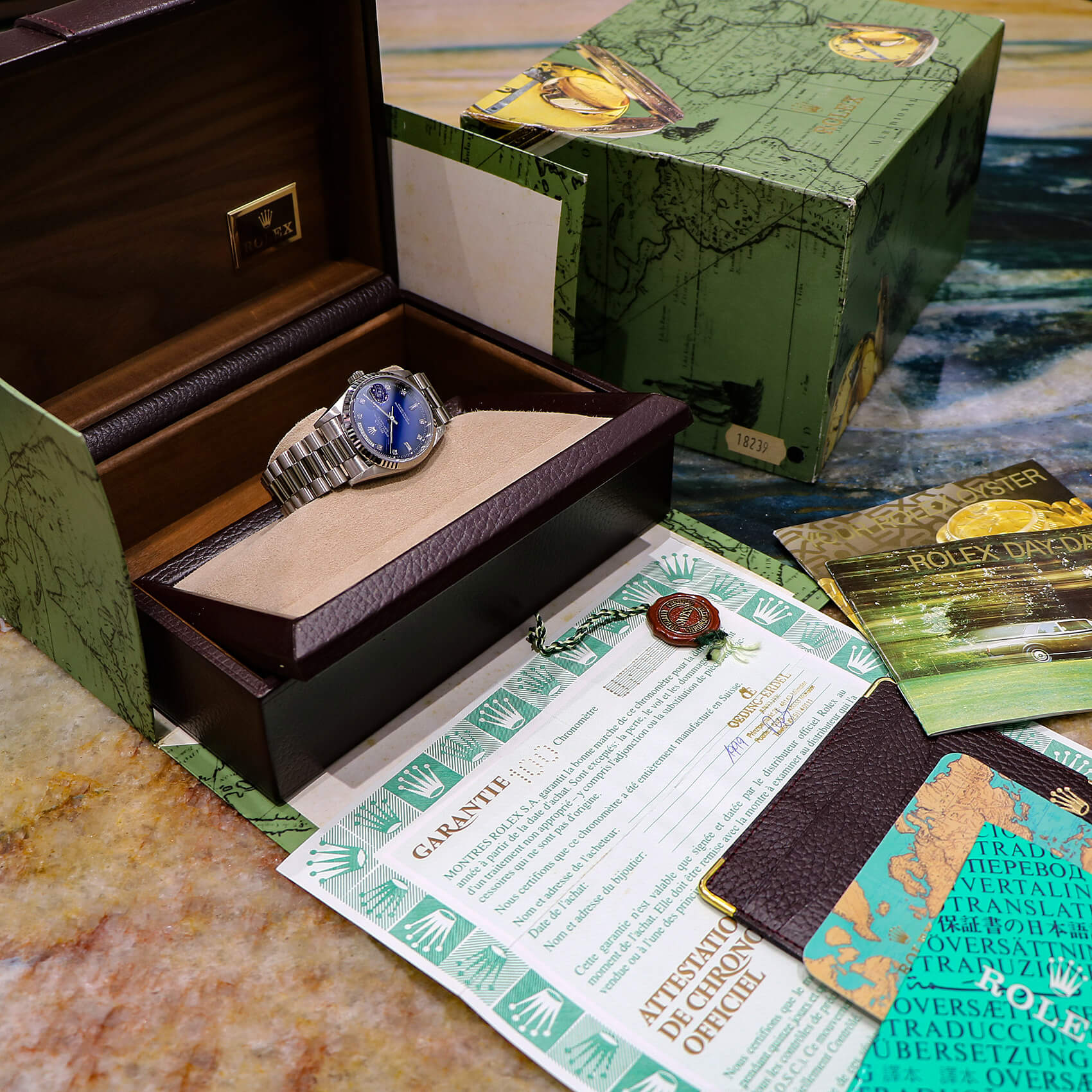 Vintage wristwatch with a blue dial in its wooden box with original papers